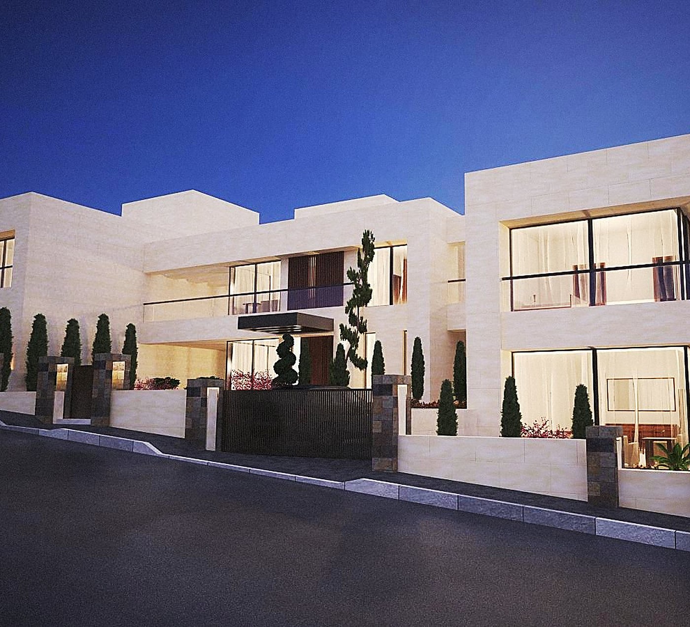 Villa B, the central residence, from the street at dusk